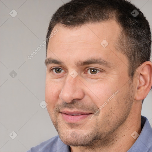 Joyful white adult male with short  brown hair and brown eyes