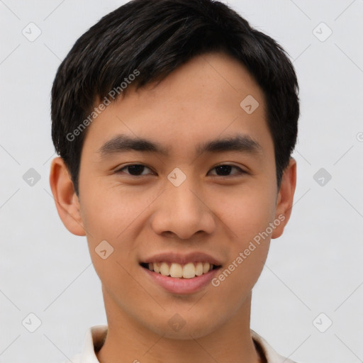 Joyful asian young-adult male with short  black hair and brown eyes