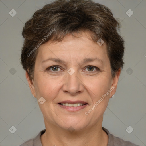 Joyful white adult female with short  brown hair and brown eyes