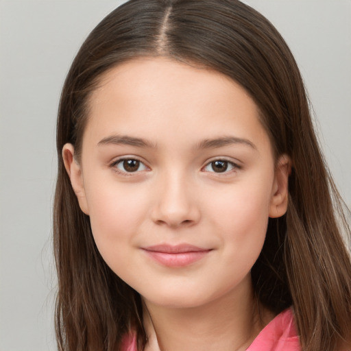 Joyful white child female with long  brown hair and brown eyes