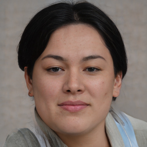 Joyful asian young-adult female with medium  brown hair and brown eyes