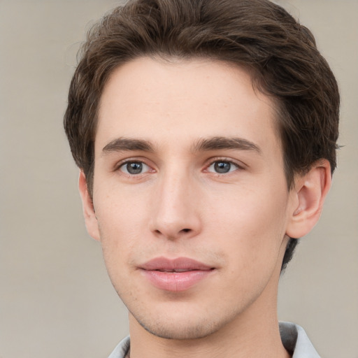 Neutral white young-adult male with short  brown hair and grey eyes