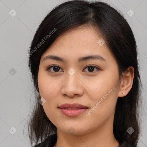 Joyful latino young-adult female with medium  brown hair and brown eyes