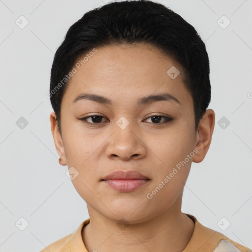 Joyful latino young-adult female with short  black hair and brown eyes