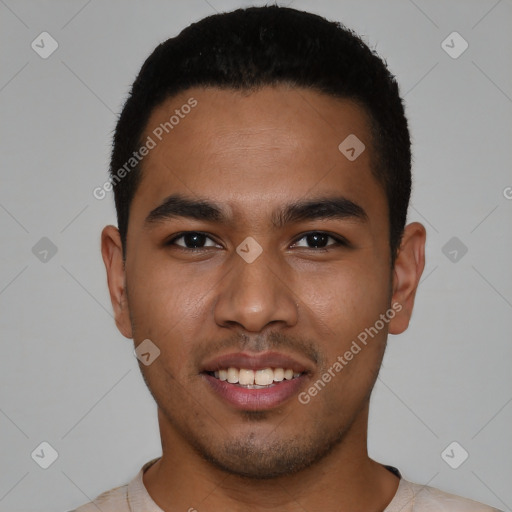 Joyful latino young-adult male with short  black hair and brown eyes