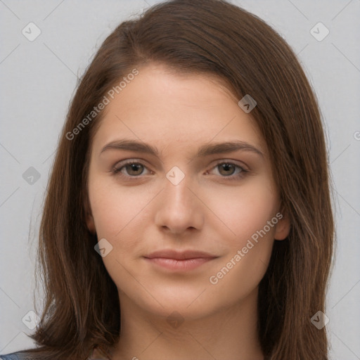 Neutral white young-adult female with long  brown hair and brown eyes