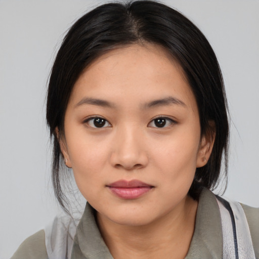 Neutral asian young-adult female with medium  black hair and brown eyes