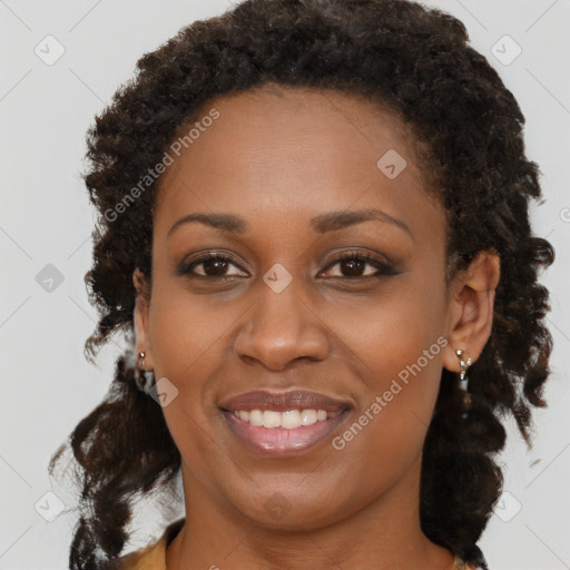 Joyful black young-adult female with medium  brown hair and brown eyes