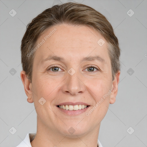 Joyful white adult male with short  brown hair and grey eyes