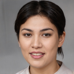 Joyful white young-adult female with medium  brown hair and brown eyes