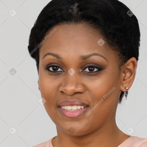 Joyful black young-adult female with short  brown hair and brown eyes