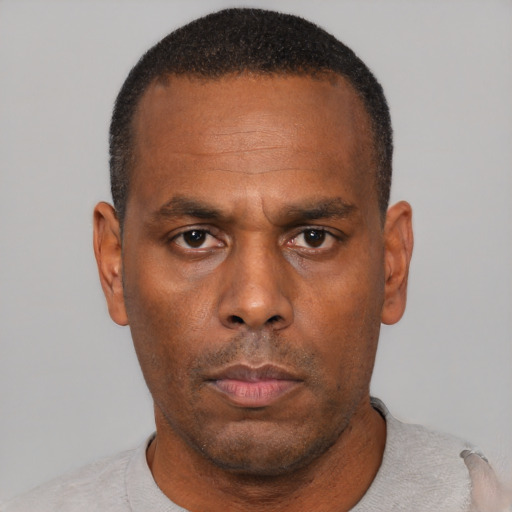 Neutral black adult male with short  black hair and brown eyes