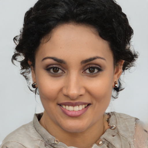 Joyful latino young-adult female with medium  brown hair and brown eyes