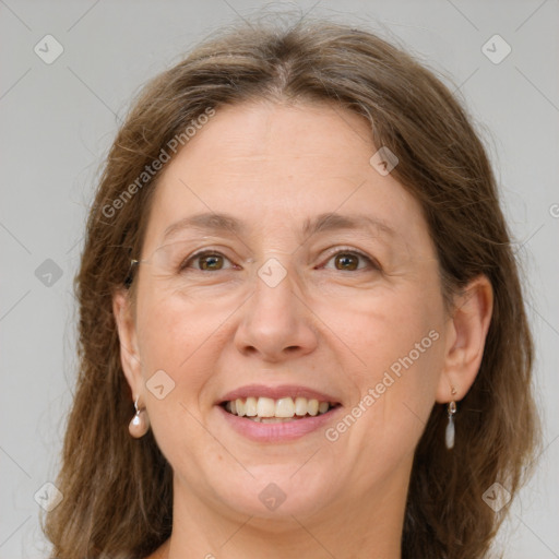 Joyful white adult female with medium  brown hair and grey eyes