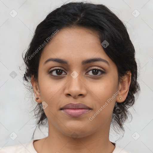 Joyful latino young-adult female with medium  brown hair and brown eyes