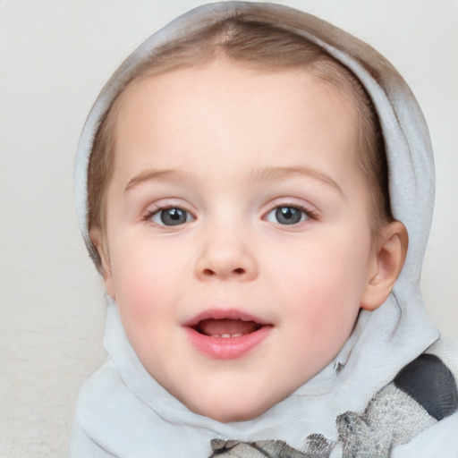 Joyful white child female with short  brown hair and blue eyes