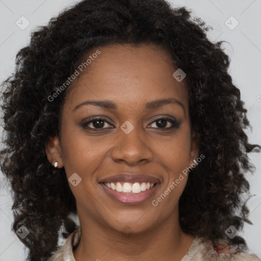 Joyful black young-adult female with long  brown hair and brown eyes