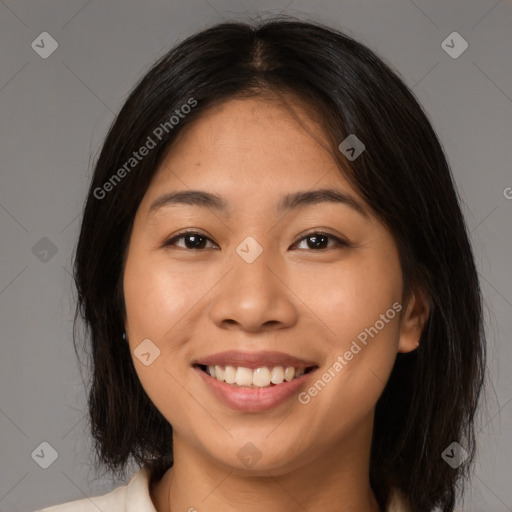 Joyful latino young-adult female with medium  brown hair and brown eyes