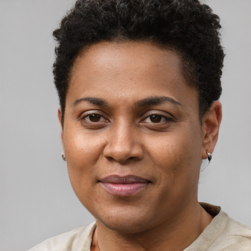 Joyful black young-adult female with short  brown hair and brown eyes