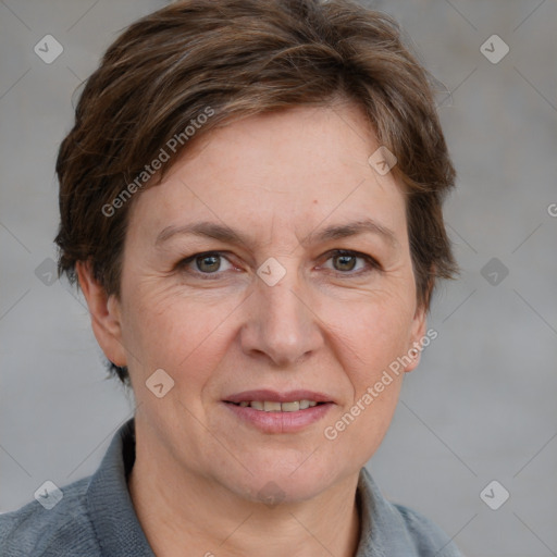 Joyful white adult female with short  brown hair and grey eyes