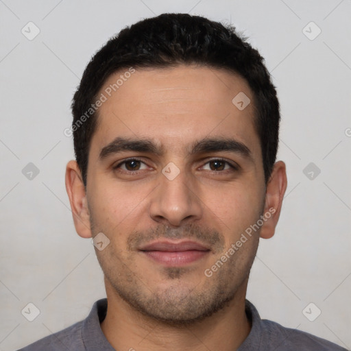 Joyful white young-adult male with short  black hair and brown eyes