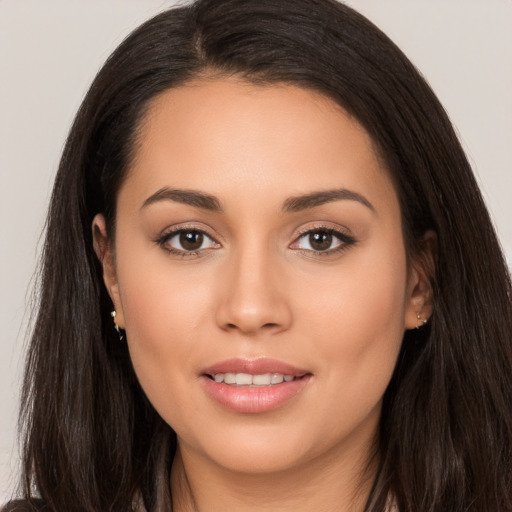 Joyful white young-adult female with long  brown hair and brown eyes