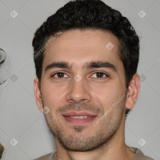 Joyful white young-adult male with short  black hair and brown eyes