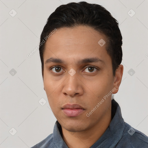 Neutral latino young-adult male with short  black hair and brown eyes