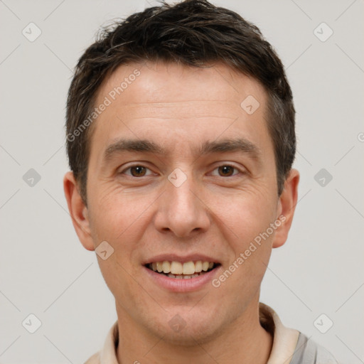 Joyful white adult male with short  brown hair and brown eyes