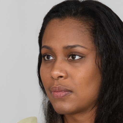 Neutral black young-adult female with long  black hair and brown eyes