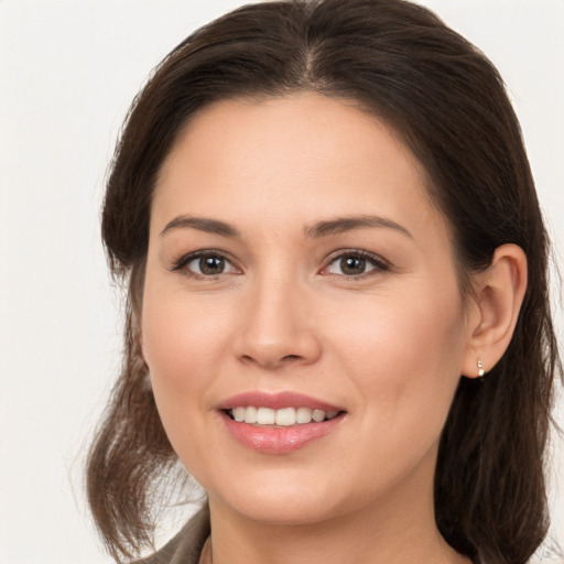 Joyful white young-adult female with medium  brown hair and brown eyes