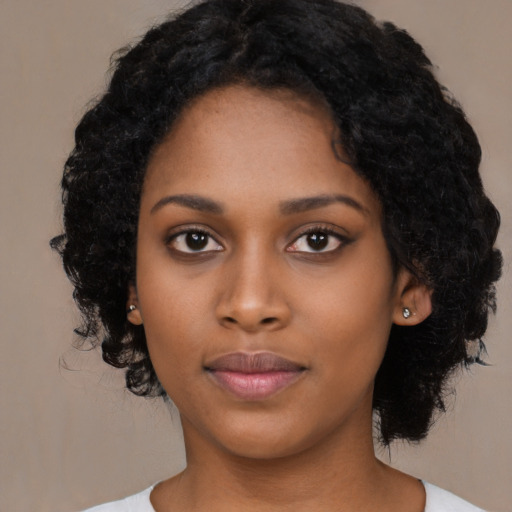Neutral black young-adult female with medium  black hair and brown eyes