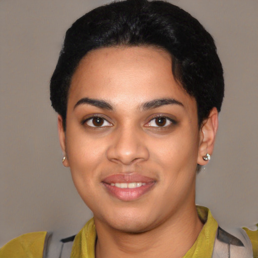 Joyful latino young-adult female with short  black hair and brown eyes