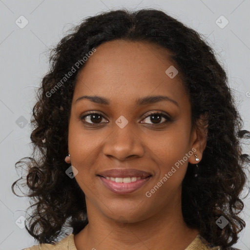 Joyful black young-adult female with long  brown hair and brown eyes