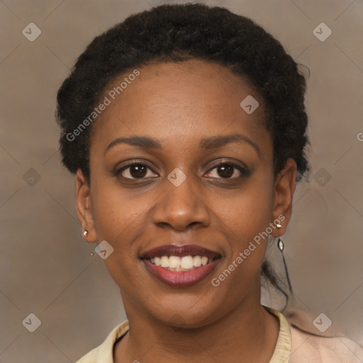 Joyful black young-adult female with short  brown hair and brown eyes