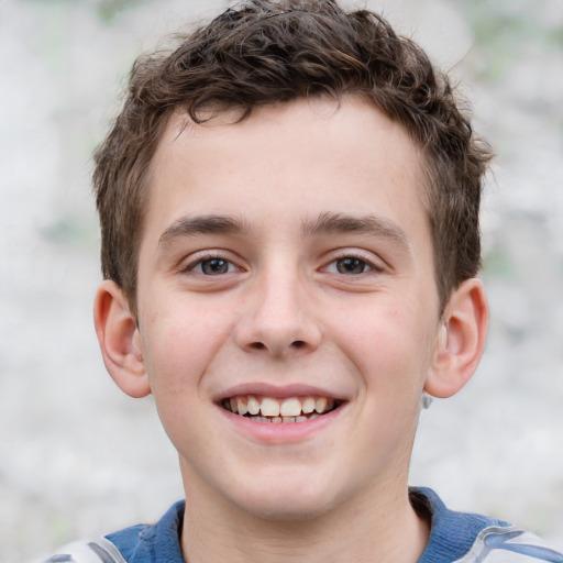 Joyful white child male with short  brown hair and grey eyes