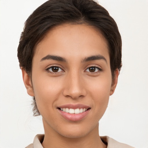 Joyful white young-adult female with short  brown hair and brown eyes