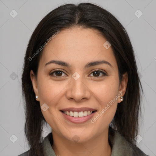 Joyful latino young-adult female with medium  brown hair and brown eyes