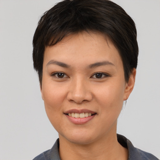 Joyful white young-adult female with short  black hair and brown eyes