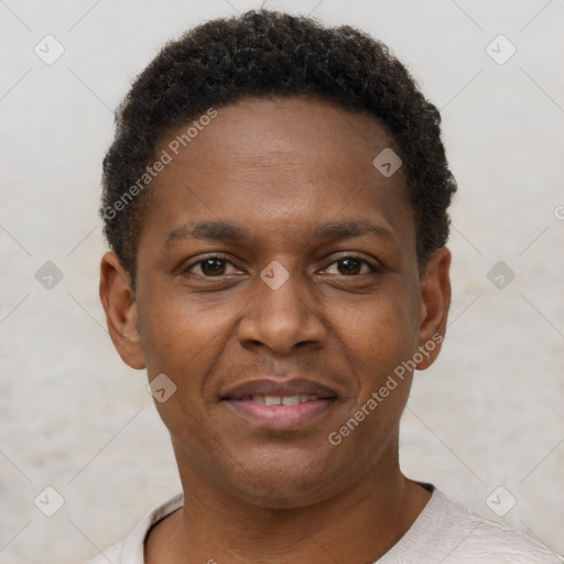 Joyful black young-adult male with short  brown hair and brown eyes