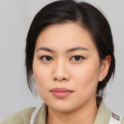 Neutral asian young-adult female with medium  brown hair and brown eyes