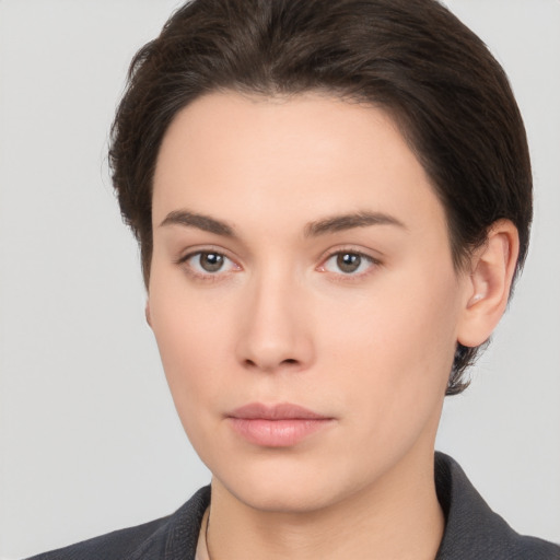 Neutral white young-adult female with short  brown hair and brown eyes