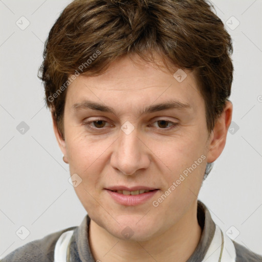 Joyful white adult male with short  brown hair and grey eyes