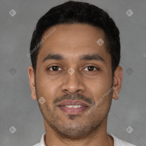 Joyful latino young-adult male with short  brown hair and brown eyes