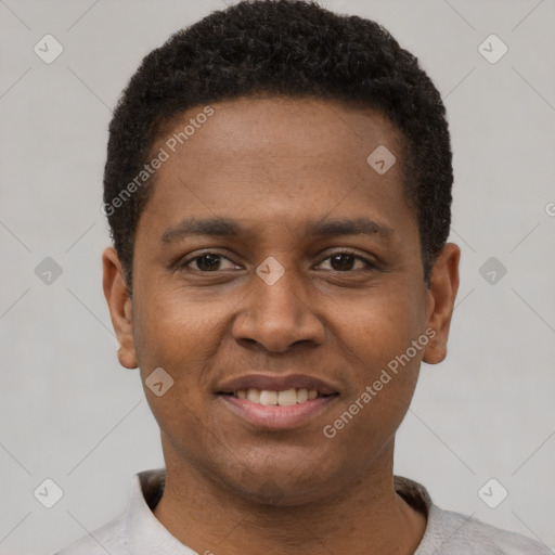 Joyful black young-adult male with short  black hair and brown eyes