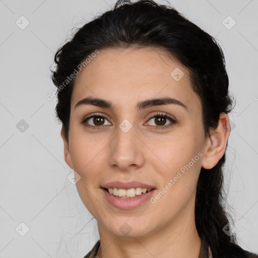 Joyful white young-adult female with long  brown hair and brown eyes