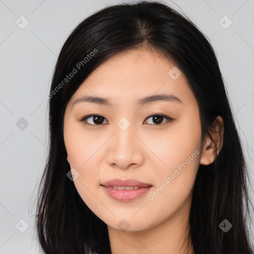 Joyful asian young-adult female with long  black hair and brown eyes