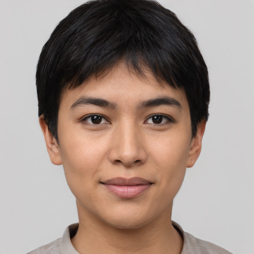 Joyful asian young-adult female with short  black hair and brown eyes