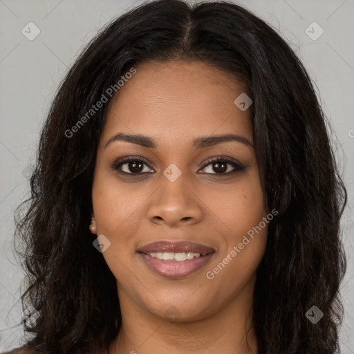 Joyful black young-adult female with long  brown hair and brown eyes