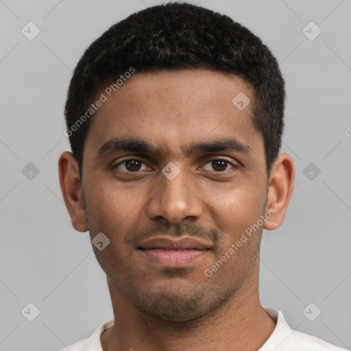 Joyful black young-adult male with short  black hair and brown eyes